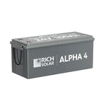 A rectangular gray Rich Solar battery labeled ALPHA 4, paired with 200W monocrystalline panels, has a spec-labeled lid and two small cables at one end, all set against a white background.