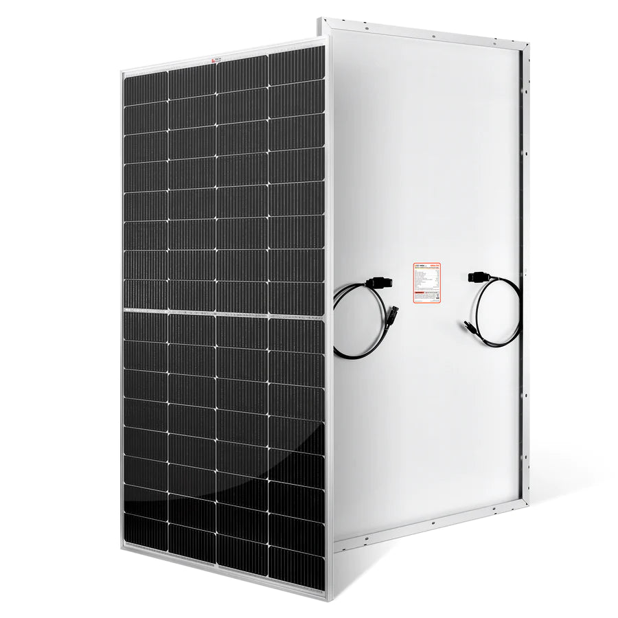 A rectangular Rich Solar panel stands upright with black photovoltaic cells under anti-reflective glass on the front, and a white back featuring electrical cables and a warning label.