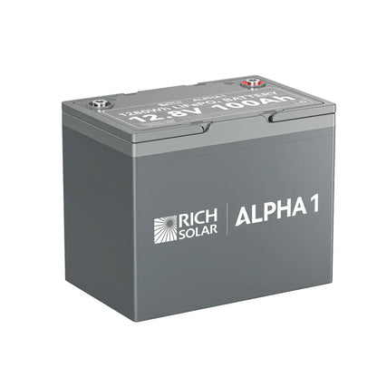 A rectangular gray Rich Solar battery labeled ALPHA 1, featuring 12.8V 100Ah specs on top and side, ideal for a 400W solar kit or MPPT charge controller, is displayed against a plain white background.