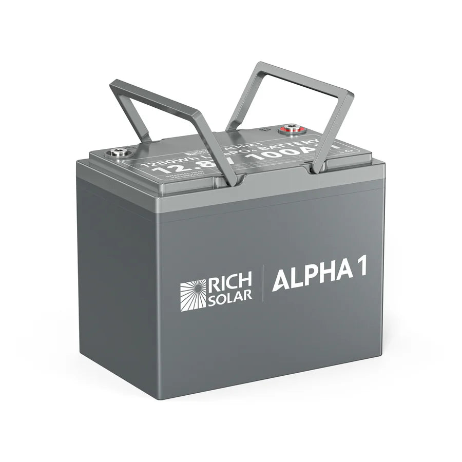 A gray Rich Solar ALPHA 1 LiFePO4 Battery, featuring two metal handles on top and labeled as a 12.8V 100Ah lithium battery, is shown against a white background.