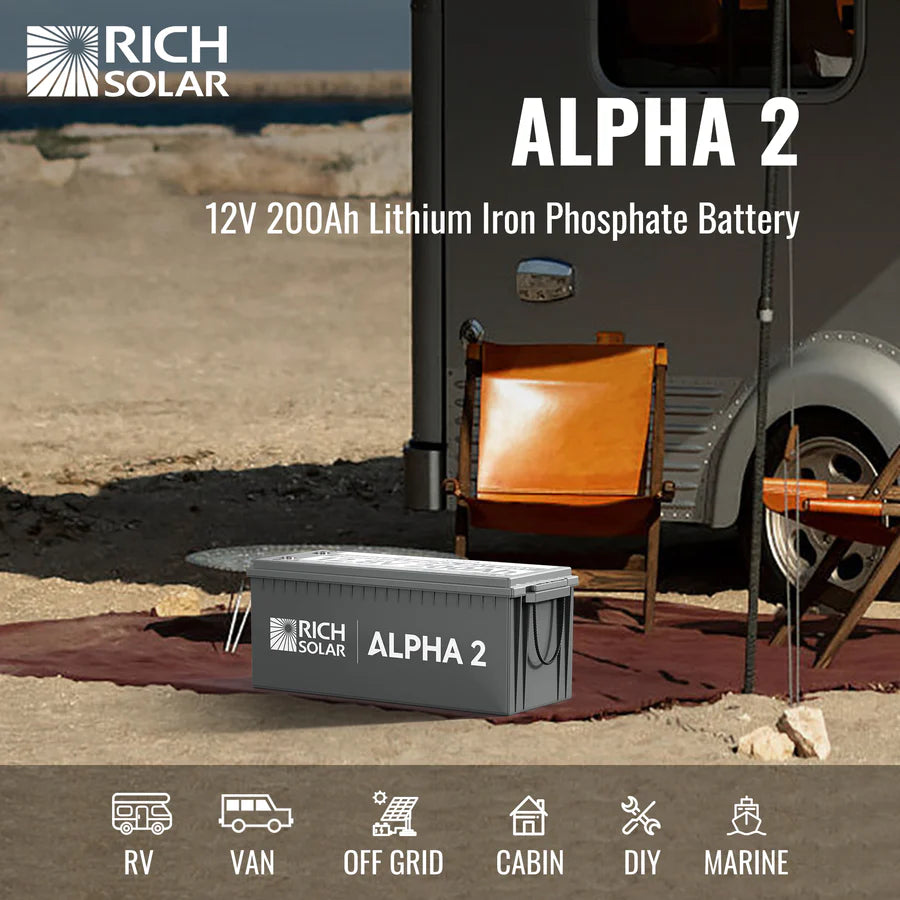 A large 200Ah Rich Solar LiFePO4 Battery sits outdoors by a brown lounge chair and trailer on a mat, showcasing its 2560Wh power for RVs, vans, cabins, off-grid living, DIY projects, and marine applications.