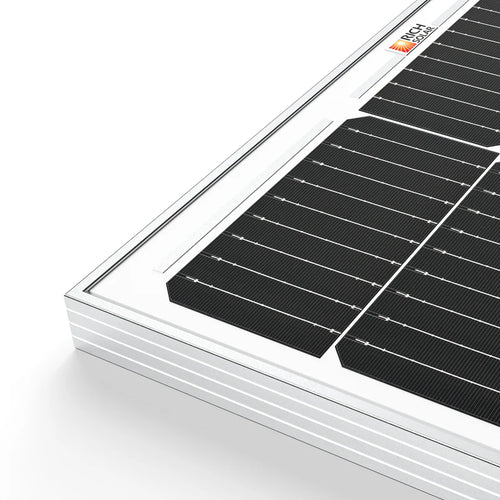 Close-up of a Rich Solar panel corner featuring high transmission tempered glass, black photovoltaic cells, and a white frame on a white background. Ideal for off-grid solar projects, with a small logo in the top right corner.