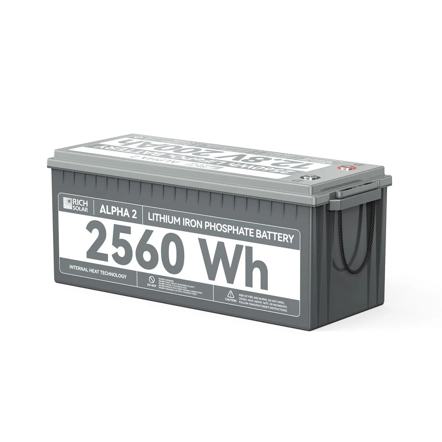 A gray rectangular LiFePO4 battery from Rich Solar, labeled ALPHA 2, 2560Wh, 200Ah, features black side handles and detailed specs on the front and top.