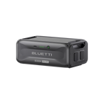 A rectangular, dark gray Bluetti portable power station labeled B300K 2764.8Wh features indicator lights, buttons, a handle, and modular design—offering an advanced energy solution against a white background.