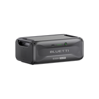 The Bluetti B300K is a portable energy solution featuring a black and gray modular design, handle, indicator lights, and 2764.8Wh capacity labeled on the front.