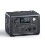 The Bluetti portable power station features a digital display, LiFePO4 battery, multiple input/output ports, two pure sine wave AC outlets, a built-in front flashlight, all in a compact black boxy design.