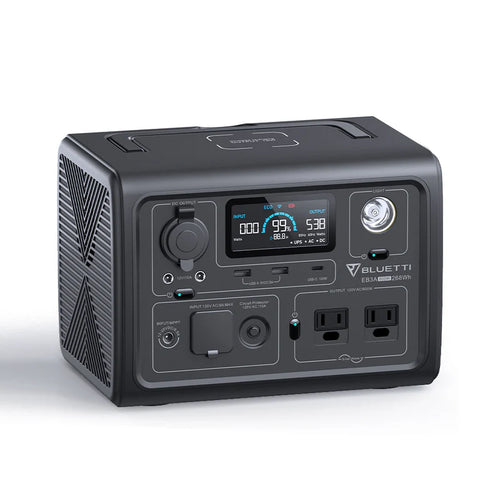The Bluetti portable power station features a digital display, LiFePO4 battery, multiple input/output ports, two pure sine wave AC outlets, a built-in front flashlight, all in a compact black boxy design.