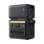 The Anker SOLIX C1000X is a black portable power station with a display screen, multiple outlets, blue and yellow accent lights, and a stacked battery module—ideal as a mobile solar generator for dependable energy anywhere.