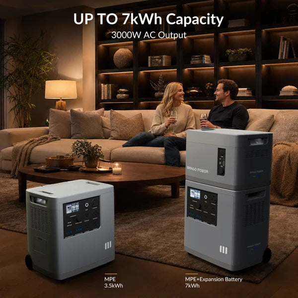 A couple sits on a sofa in a cozy living room, enjoying a relaxed conversation. Two portable power stations are displayed nearby: one is a stackable unit labeled MPE 3.5kWh, and the other features an expansion battery for a total capacity of 7kWh—ideal options for reliable home backup power.