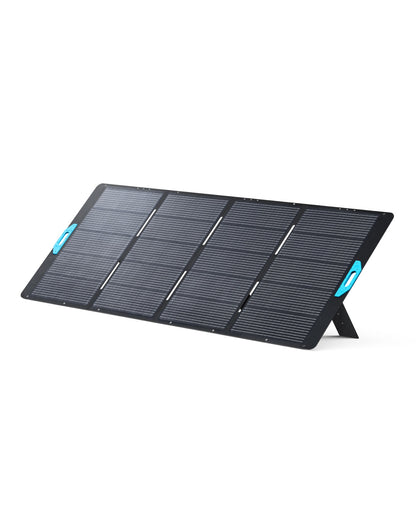 A portable black Anker solar panel with six rectangular sections, blue handles on each side, and stands angling it on a white background—ideal for off-grid power or emergency backup needs.