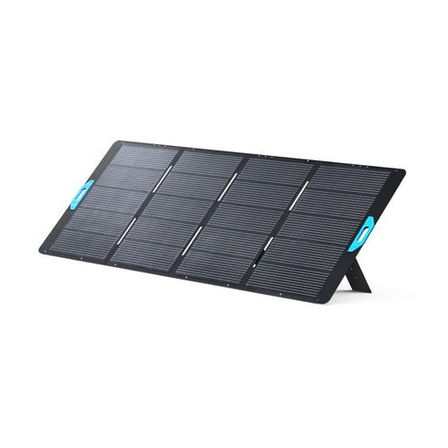 The Anker portable rectangular solar panel features eight sections, blue side handles, and a fold-out stand for angled support. When combined with the Solix F3800 power station, it delivers impressive solar input. Shown on a white background.