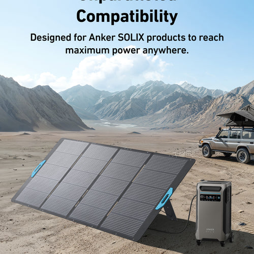 An Anker SOLIX PS400 Solar Panel and portable power station are set up on sandy desert terrain with mountains behind. A solar-equipped vehicle is parked nearby. Text: Unparalleled Compatibility & IP67 Waterproof—maximum power anywhere.