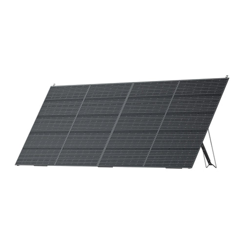 A Bluetti black rectangular PV420 solar panel with monocrystalline cells is propped up at an angle on a foldable stand, set against a plain white background.
