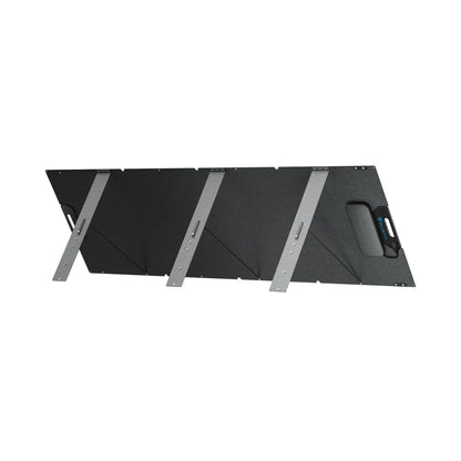 A black, rectangular Bluetti solar panel with four angled metallic support legs and a built-in carrying handle is shown against a white background—an ideal portable power solution.