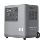 A portable gray power station by Mango Power with advanced LFP battery cells, multiple outlets, USB ports, a display screen, and wheels for easy mobility—ideal for off-grid adventures.