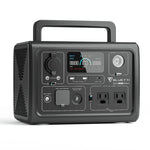 The Bluetti portable power station features a LiFePO4 battery, digital display, control buttons, multiple input/output ports, two AC outlets, and a top carrying handle.