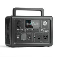 The Bluetti portable power station features a LiFePO4 battery, digital display, control buttons, multiple input/output ports, two AC outlets, and a top carrying handle.