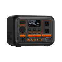 The Bluetti portable power station features a LiFePO4 battery, LED display, multiple input/output ports, two AC outlets, and distinct orange and black buttons for various power functions.