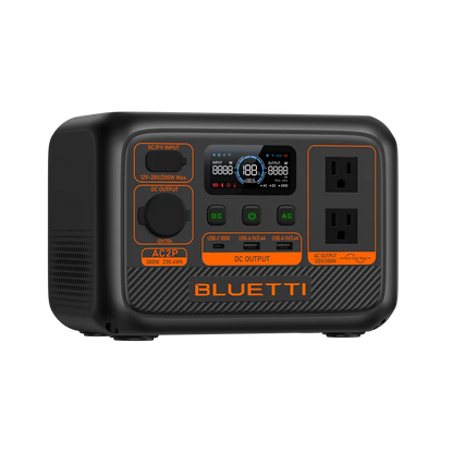 The Bluetti portable power station features a LiFePO4 battery, LED display, multiple input/output ports, two AC outlets, and distinct orange and black buttons for various power functions.