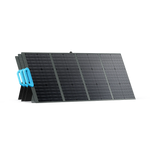 The Bluetti portable solar panel features four black monocrystalline sections propped at an angle, with a blue handle for easy carrying—ideal for use with Bluetti generators.