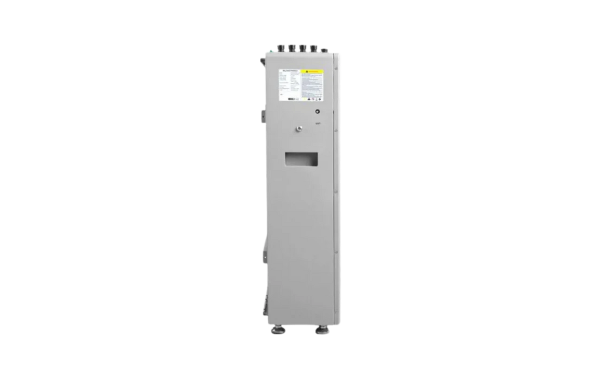 A tall, gray EG4 industrial electrical panel stands upright with a small display featuring crisp IBM Plex Sans font, a rectangular cutout with subtly rounded edges, and a warning label on its front. The unit is equipped with four leveling feet and several connectors positioned on top.