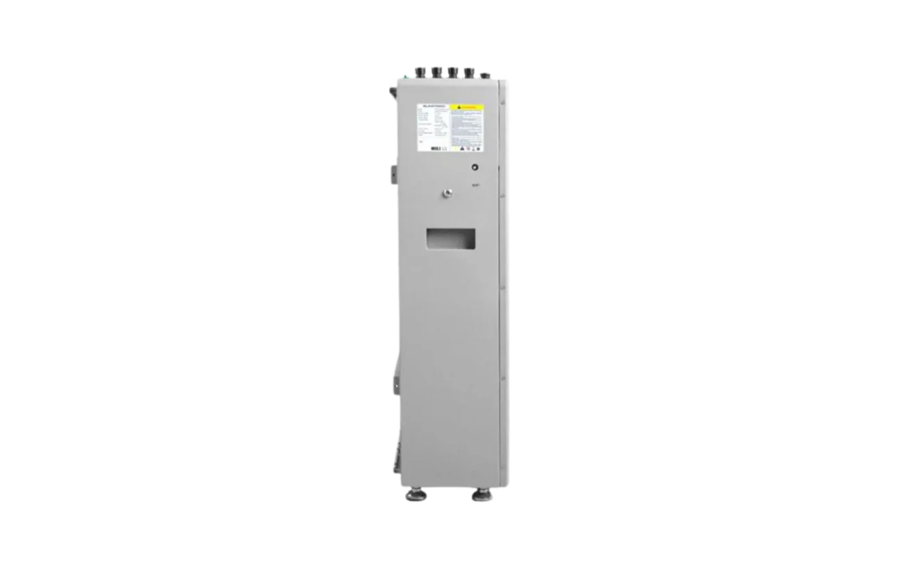 A tall, gray EG4 industrial electrical panel stands upright with a small display featuring crisp IBM Plex Sans font, a rectangular cutout with subtly rounded edges, and a warning label on its front. The unit is equipped with four leveling feet and several connectors positioned on top.