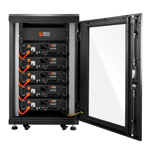 A black server rack on wheels with a glass door is open, showing five stacked Rich Solar lithium batteries with BMS, orange cables, visible wiring, and control panels.