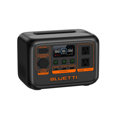 The Bluetti portable power station has a LiFePO4 battery, digital display, two AC outlets, multiple input/output ports, and distinctive orange accents on a sleek black compact rectangular body.