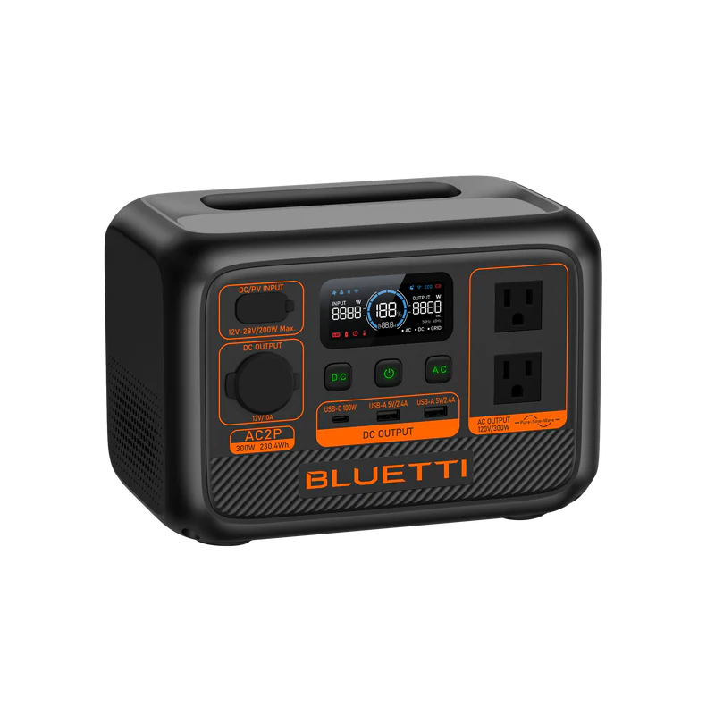 The Bluetti portable power station has a LiFePO4 battery, digital display, two AC outlets, multiple input/output ports, and distinctive orange accents on a sleek black compact rectangular body.