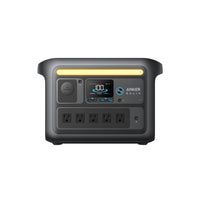 Front view of the Anker power station with display, power button, multiple charging ports, four AC outlets, and a yellow top handle—perfect for camping gear and devices with reliable LiFePO4 batteries.