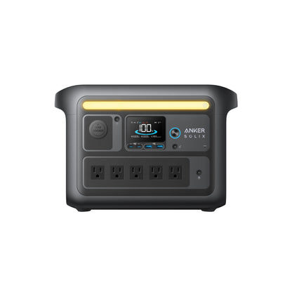 Front view of the Anker power station with display, power button, multiple charging ports, four AC outlets, and a yellow top handle—perfect for camping gear and devices with reliable LiFePO4 batteries.