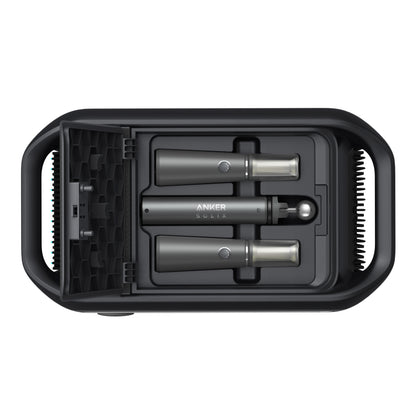 Top-down view of a black Anker case for the Solix power station, holding two cylindrical tools with metallic ends and an accessory, all neatly fitted in custom slots.