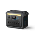 An Anker SOLIX C1000X portable power station in black, featuring a digital display, four AC outlets, and a built-in handle, is displayed against a white background.