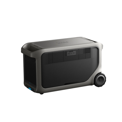 The Anker portable power station features a rectangular dark body, LiFePO₄ battery, side vents, front control buttons, and two large wheels on one end for easy off-grid power and transport.
