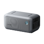 A rectangular Anker SOLIX C2000 Gen 2 portable power station with a gray textured surface, a blue power button, vented sides, and multiple input/output ports is photographed against a plain white background.