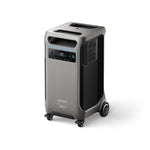 The Anker SOLIX is a portable power station in gray with black accents, top handles, wheels for transport, a digital display, control buttons, multiple side outlets, and supports solar input for reliable backup power.