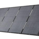 The Anker portable foldable solar panel features four black sections on a built-in stand and blue side handles for easy carrying—ideal for generator charging or solar input, providing reliable backup power anywhere.