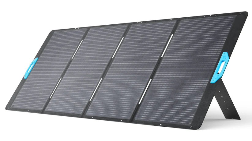 The Anker portable foldable solar panel features four black sections on a built-in stand and blue side handles for easy carrying—ideal for generator charging or solar input, providing reliable backup power anywhere.
