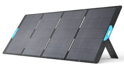 The Anker portable foldable solar panel features four black sections on a built-in stand and blue side handles for easy carrying—ideal for generator charging or solar input, providing reliable backup power anywhere.