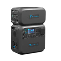 Two black Bluetti power stations are stacked, each with multiple ports, control buttons, and blue-accented digital displays featuring Bluetti branding for versatile charging.