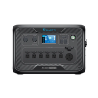 The Bluetti AC300 3000W portable power station in black features multiple outlets, control knobs, a digital display, large power button, supports 5400W fast charging, and offers an expandable power supply.