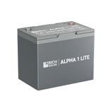 A gray rectangular LiFePO4 battery from Rich Solar labeled ALPHA 1 LITE, featuring top terminals and 12.8V 200Ah marked on the lid.