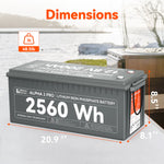 A Rich Solar 2560Wh LiFePO4 Battery (200Ah) sits outside near snow, a lake, and a chair. Text notes its size: 20.9 x 8.1 x 8.5 inches and weight of 48.5 lb.