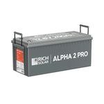 A rectangular gray Rich Solar ALPHA 2 PRO 12.8V 200Ah LiFePO4 Battery with black handles and a red-and-white label; its 2560Wh capacity is clearly marked on the lid for easy identification.