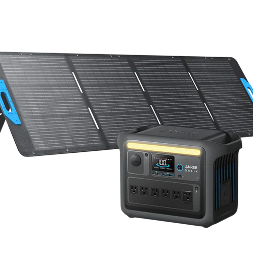 A portable solar panel is set up at an angle beside a black Anker SOLIX C1000X Portable Power Station, which features multiple outlets and a front display screen.