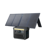 An Anker portable solar panel is angled behind the Anker SOLIX C1000X Portable Power Station, which features multiple outlets and a digital display on its front.