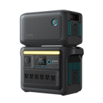 The stackable Anker SOLIX portable power station offers solar charging, multiple AC outlets, a digital display, control buttons, carrying handles, and blue accent lights on a sleek black and gray design.
