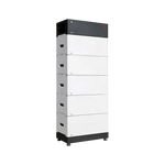 The BYD Battery-Box is a tall, rectangular storage unit with a black top and five stacked white lithium iron phosphate modules, each with handles. It features a modern, industrial design and belongs to BYD’s high-voltage series.