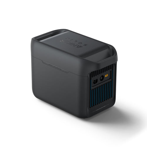 A compact Anker SOLIX C1000X Portable Power Station in black features a sleek design, vented side panel, multiple ports, and a top handle, all displayed on a white background.