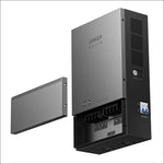 A sleek, gray Anker power inverter is wall-mounted with its front cover removed and displayed to the left, showcasing internal electrical components and ports—perfect for backup power or home panel integration.